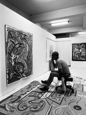 Beat Baumann painting in his studio